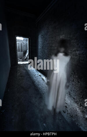 Horror ghost girl appears in an old building. Creepy movie scene Stock ...