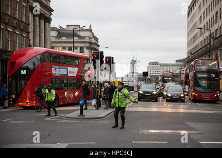 London, UK. 21st February, 2017. Police officers control traffic and pedestrians at a major intersection between the Strand, Aldwych and Waterloo Bridge where all traffic lights were simultaneously stuck on red. Credit: Mark Kerrison/Alamy Live News Stock Photo