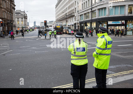 London, UK. 21st February, 2017. Police officers control traffic and pedestrians at a major intersection between the Strand, Aldwych and Waterloo Bridge where all traffic lights were simultaneously stuck on red. Credit: Mark Kerrison/Alamy Live News Stock Photo