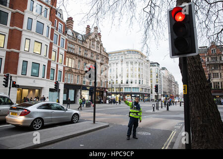 London, UK. 21st February, 2017. Police officers control traffic and pedestrians at a major intersection between the Strand, Aldwych and Waterloo Bridge where all traffic lights were simultaneously stuck on red. Credit: Mark Kerrison/Alamy Live News Stock Photo