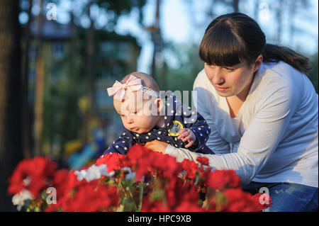 mother holds a baby daughter Stock Photo