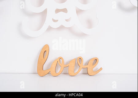 wooden word love on a white background in studio Stock Photo
