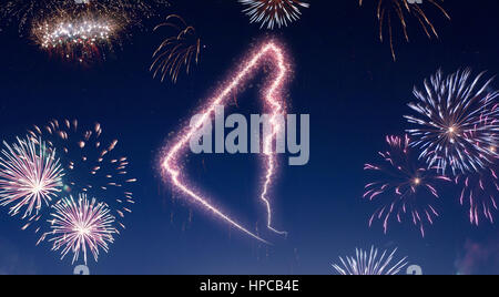 A dark night sky with a sparkling red firecracker in the shape of Yukon composed into.(series) Stock Photo