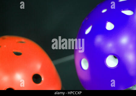 Inline and quad roller skates helmets head protection in retail skate shop display on sale. Stock Photo