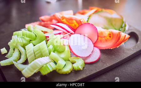 Chopped Salad Vegetables on a chopping board Stock Photo