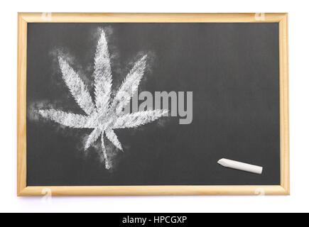 Blackboard with a weed leaf drawn on and a single chalk.(series) Stock Photo