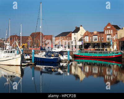 Boats and Buildings on Humber Dock Street reflected in Hull Marina Hull Yorkshire England Stock Photo