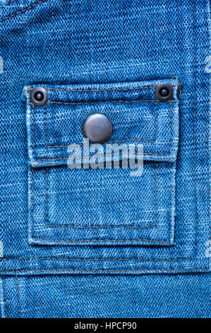 texture of denim with a pocket sewn in the middle thread Stock Photo