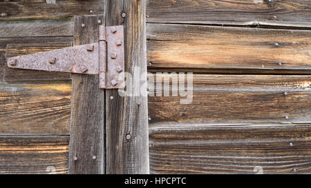 Rusted Strap Hinge on Old Barn Door Stock Photo
