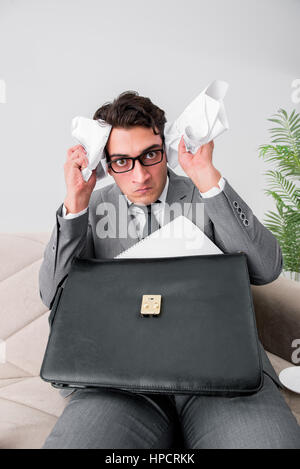 Angry businessman with crumbled paper Stock Photo