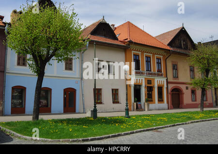Kezmarok, Slovakia - May 15, 2013: Colourful houses on the Main street of Kezmarok, Slovakia, a small town in Spis region, Poprad river. Stock Photo