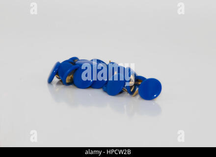 Blue push pins on a white background Stock Photo