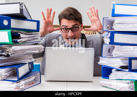 Busy businessman under stress due to excessive work Stock Photo