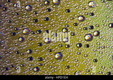 Colorful abstract formed by water droplets on the surface of a cd Stock Photo