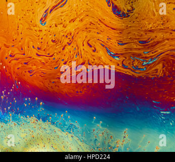 Psychedelic patterns formed on the surface of soap bubbles Stock Photo