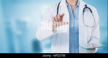 Cropped image of female doctor holding digital tablet while using invisible screen against dental equipment Stock Photo