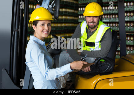 Portrait of smiling factory workers in factory