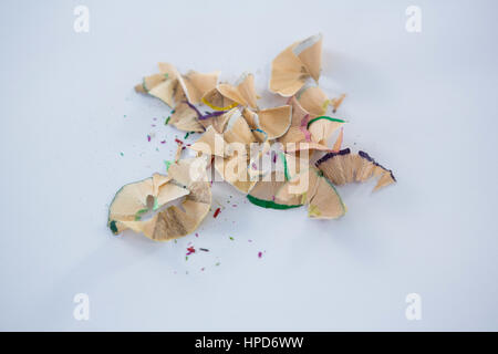 Close-up of colored pencils shavings on a white background Stock Photo