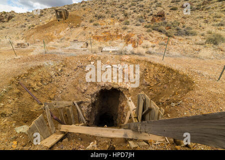Old abandoned gold mine entrance in the Nevada desert near ghost town.