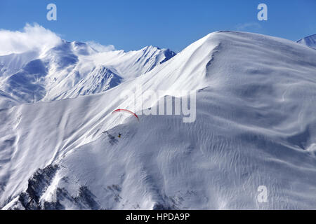 Speed flying in snow winter mountains. Caucasus Mountains. Georgia, region Gudauri. Stock Photo