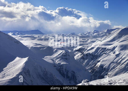 Speed flying in sun winter mountains. Caucasus Mountains. Georgia, region Gudauri. Stock Photo