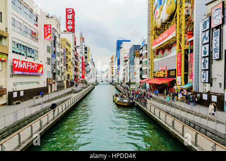 OSAKA, JAPAN - JANUARY 21: Dotonbori shopping area where tourists go to shop and take a river cruise on January 21, 2016 in Osaka. Stock Photo