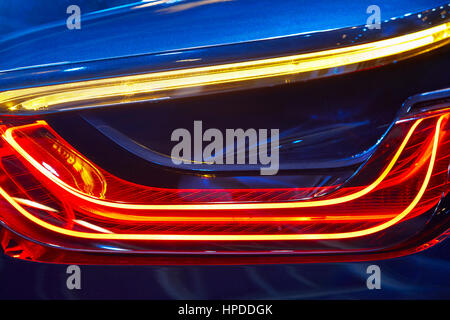 Rear car light detail in blue red tone. Vehicle part. Horizontal Stock Photo