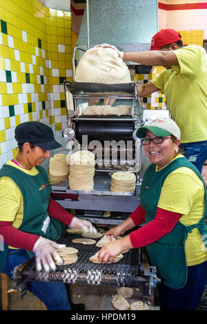 Florida Homestead,Mexico Market,Hispanic grocery store,interior inside,supermarket,food,display sale woman female women,employees,tortilla,tortillera, Stock Photo