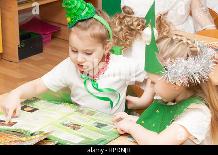 ST. PETERSBURG, RUSSIA - DECEMBER 28: Festively dressed children are engaged in kindergarten,RUSSIA - DECEMBER 28 2016. In Russia in New Year's Eve da Stock Photo