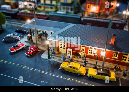 A shallow depth-of-field shot of a detailed miniature train station set. Stock Photo