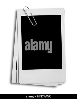 Retro style instant photographs, paper clip and blank space, isolated on white background. Stock Photo