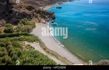 Preveli Beach in Crete island, Greece. There is a palm forest and a river inside the gorge near this beach. Stock Photo