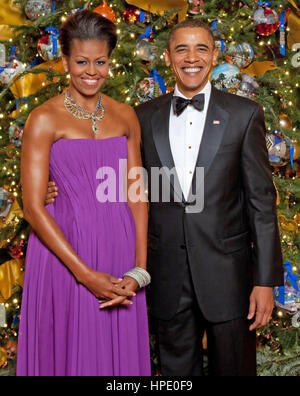 PRESIDENT BARACK OBAMA  and First Lady Michelle Obama in front of the White House Christmas Tree in the Blue Room of the White House, 6 December 2009.  Photo Lawrence Jackson/White House Stock Photo