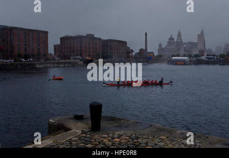 Salthouse Dock. Celebration of the Dragon Boat Race.To the right the three graces of Pier Head (the Royal Liver Building, The Cunard Building and the  Stock Photo