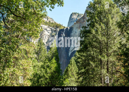 Bridalveil Fall is one of the most prominent waterfalls in the Yosemite Valley in California, seen yearly by millions of visitors to Yosemite National Stock Photo