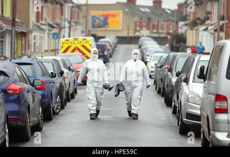 Forensic officers walk along Graham Street near where specialist officers continue excavation work at two properties on Broad Street, Swindon, where double murderer Christopher Halliwell lived. Stock Photo