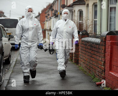 Forensic officers walk along Graham Street near where specialist officers continue excavation work at two properties on Broad Street, Swindon, where double murderer Christopher Halliwell lived. Stock Photo