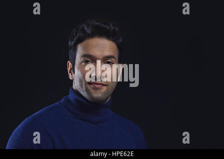 Portrait of a smiling man wearing blue colour polo neck t-shirt Stock Photo