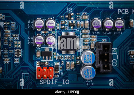Integrated semiconductor microchip/microprocessor on blue circuit board Stock Photo