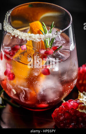 Close up of glass of pomegranate and orange juice with fresh fruits Stock Photo