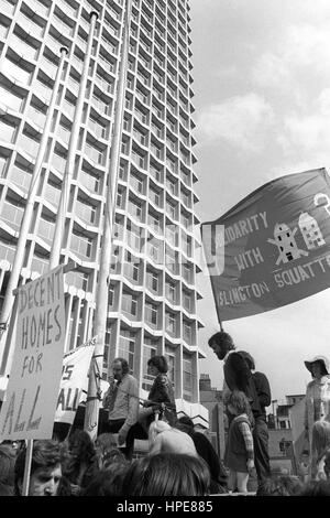 Social worker John Connor speaking at a 'homes for all' demonstration today at Centre Point (seen left), the controversial unoccupied skyscraper at St Giles Circus in central London. The meeting followed a march from Islington Town Hall. Stock Photo