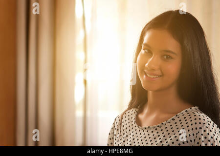 Portrait of smiling teenage girl Stock Photo