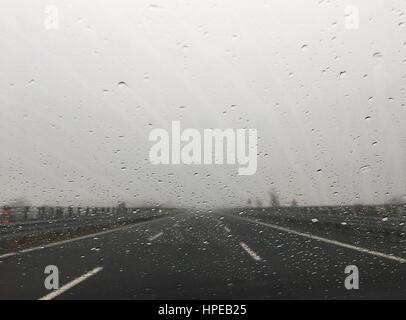 to travel in highway with rain and fog Stock Photo
