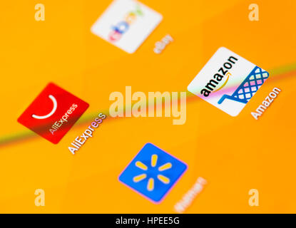 The icons of AliExpress, Ebay, Amazon and Walmart online shopping apps on a smartphone's touchscreen Stock Photo