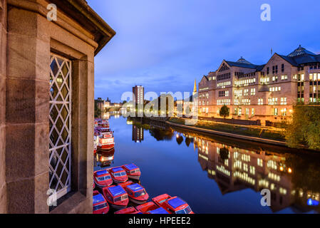 Colourful passenger ferries moored on the bank of the River Ouse in York waiting to take tourists on a sightseeing cruise Stock Photo