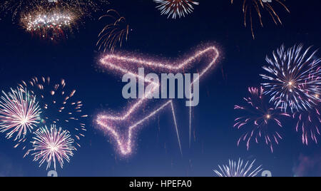 A dark night sky with a sparkling red firecracker in the shape of an airplane composed into.(series) Stock Photo