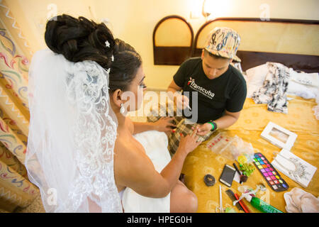 Make-up, nails, getting dressed - the usual prepping for unusual wedding ceremony - Wedding day of Cuban transgender woman, Malu Cano, a transgender r Stock Photo