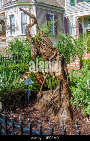 GALVESTON, TEXAS, JANUARY 2017: After hurricane Ike (2008), artists carved sculptures into remaining stumps as a reminder: Two Herons by Dayle Lewis Stock Photo
