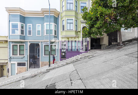 Classic urban scene of historic colorful buildings along one of San Francisco's steepest streets near Telegraph Hill residential area district on a be Stock Photo