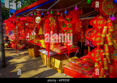 SHENZEN, CHINA - 29 JANUARY, 2017: Street stores selling traditional red golden decorations, chinese tradition as part of new year celebrations. Stock Photo